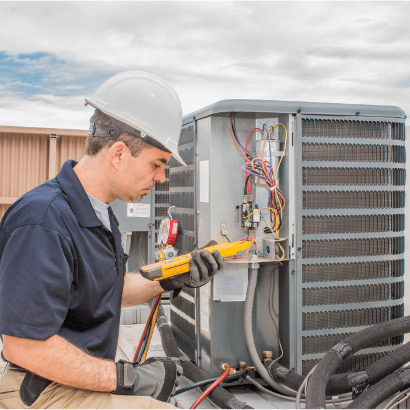 Guelph AC Repair HVAC technician servicing a system