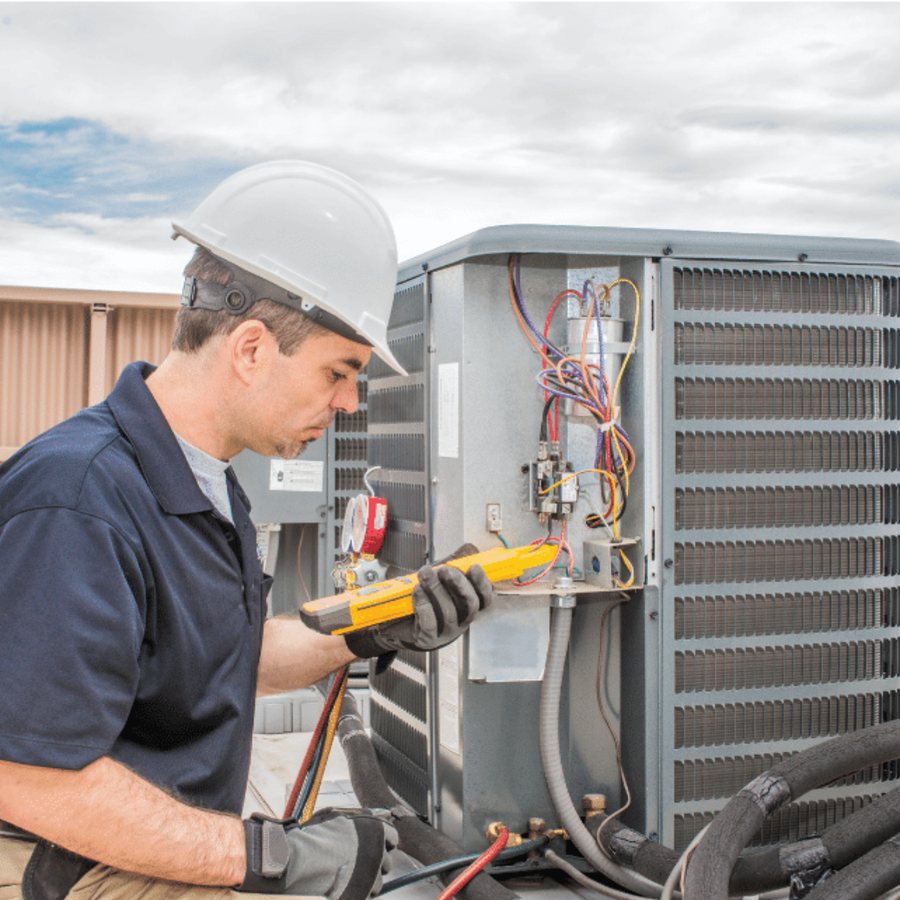Guelph AC Repair HVAC technician servicing a system