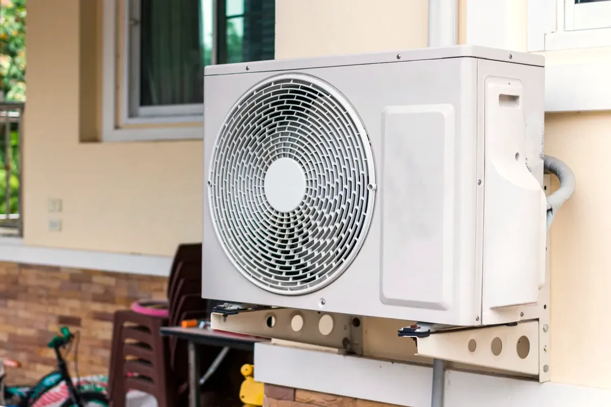 Outdoor heat pump unit on a wall bracket